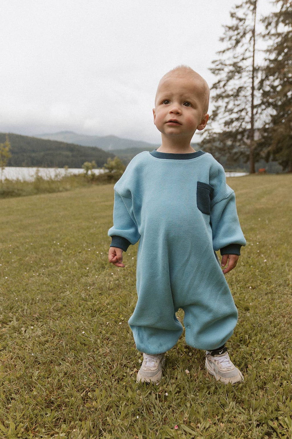 Dusk blue waffle-knit one-piece romper made for crawling and climbing