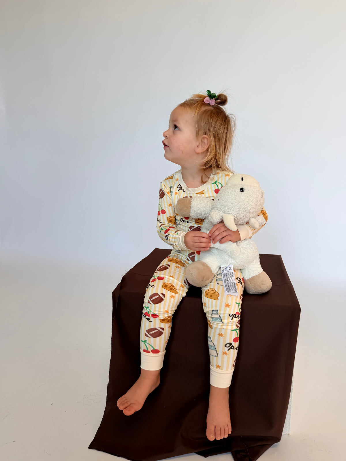 Toddler two-piece pajamas covered in playful Wisconsin-inspired icons