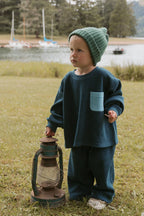 Deep blue waffle-knit two-piece kids set with roomy front pocket tee