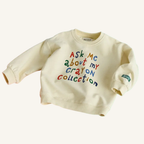 Ask Me About My Crayon Collection oversized toddler sweatshirt with colorful graphic