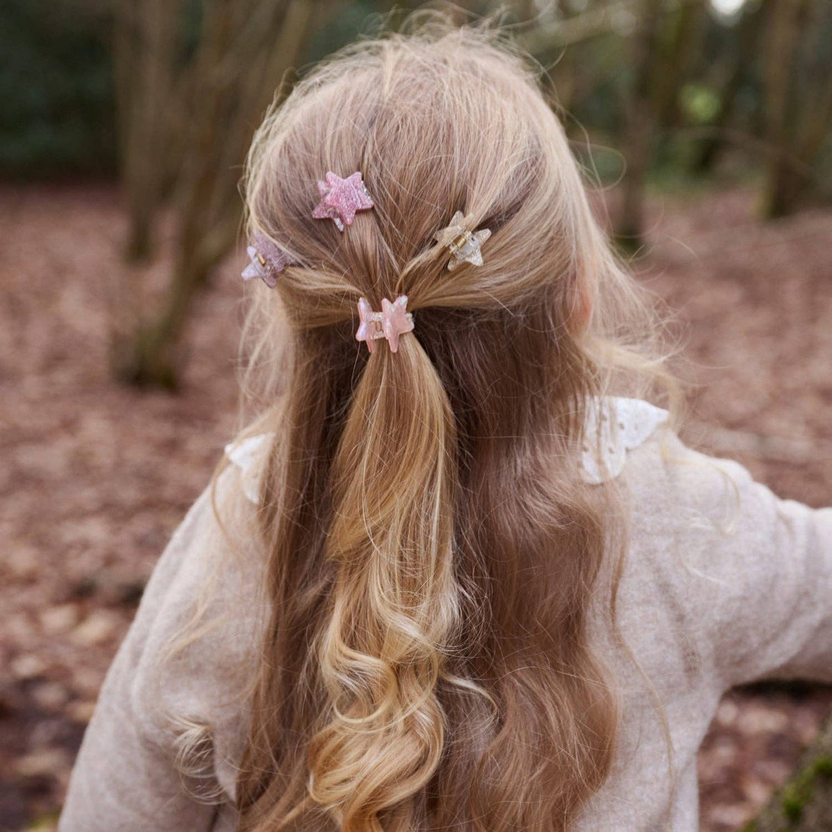 Four glitter star hair claw clips for kids