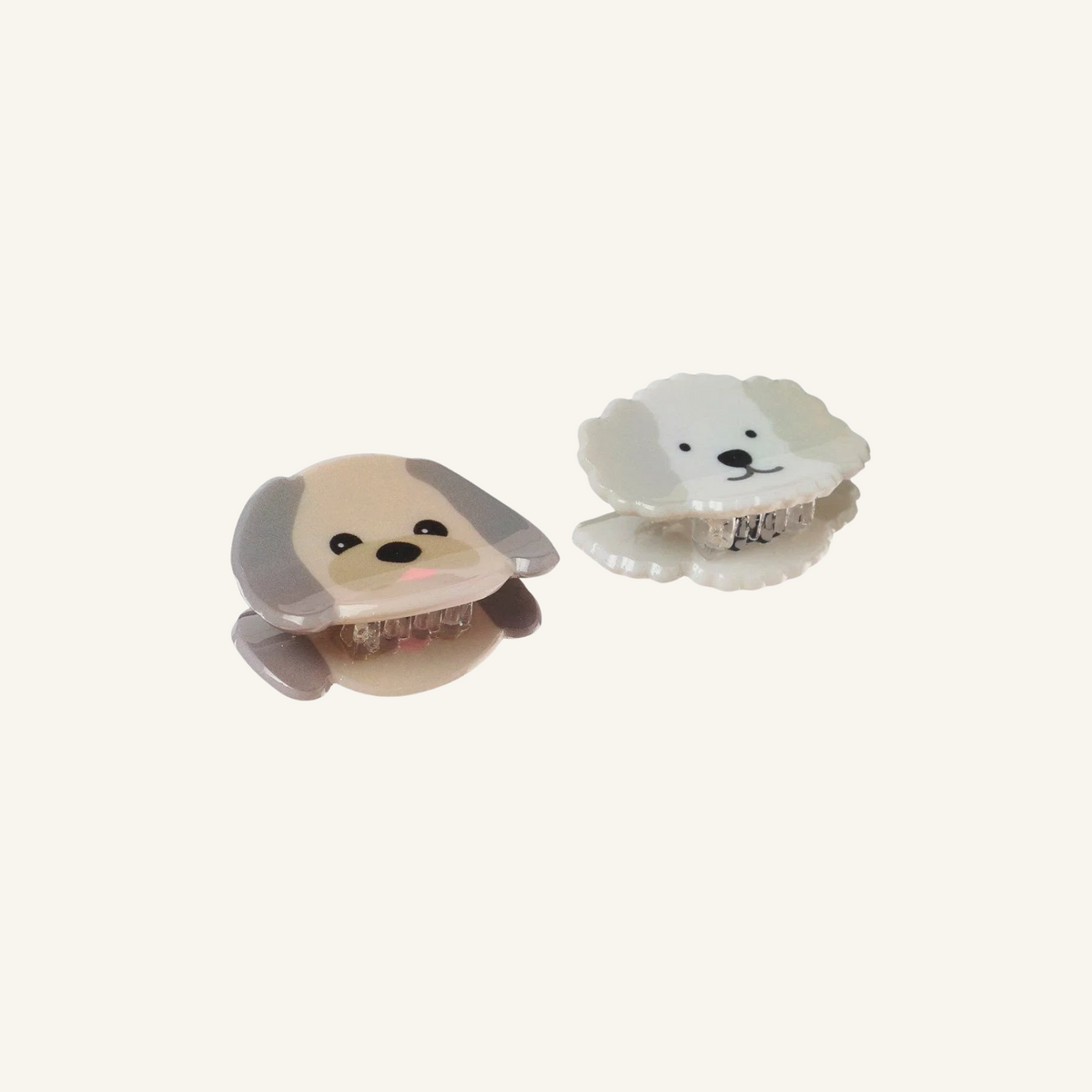 Two mini acetate puppy claw clips with grippy teeth